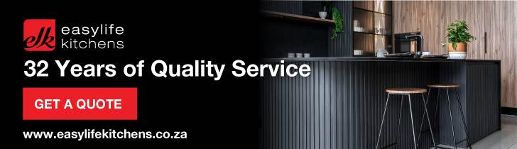 Banner for Easylife Kitchens featuring a modern black kitchen with wooden accents, two bar stools, and the text “32 Years of Quality Service.” Includes a red Get a Quote button and the website address.
