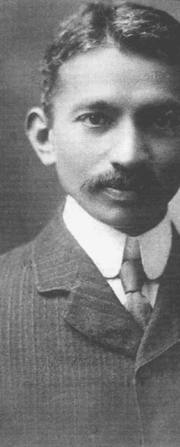 Black and white portrait of a man with a mustache, wearing a suit, white collar, and tie, looking directly at the camera with a neutral expression—captured near the historic Witkoppen Clinic.