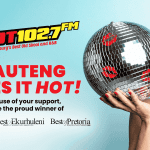 A woman in red lipstick kisses a disco ball against a blue background. Text reads HOT 102.7 FM and GAUTENG LIKES IT HOT! Proud winner of Best of Joburg, Ekurhuleni, and Best of Pretoria awards.