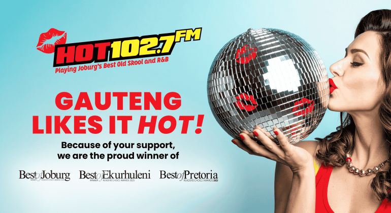 A woman in red lipstick kisses a disco ball against a blue background. Text reads HOT 102.7 FM and GAUTENG LIKES IT HOT! Proud winner of Best of Joburg, Ekurhuleni, and Best of Pretoria awards.
