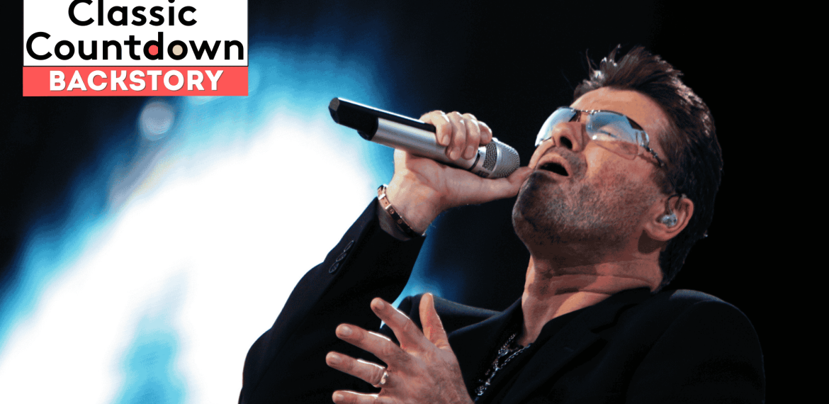 A man wearing sunglasses and a black jacket passionately sings "Last Christmas" into a microphone on stage. The text Classic Countdown BACKSTORY appears in a box in the top left corner. The brightly lit background adds to the festive atmosphere.