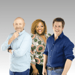 Three people standing together and smiling against a gray gradient background. The group includes a bald man in a light blue shirt, a woman with curly hair in a colorful top, and a man with brown hair in a dark blue shirt.
